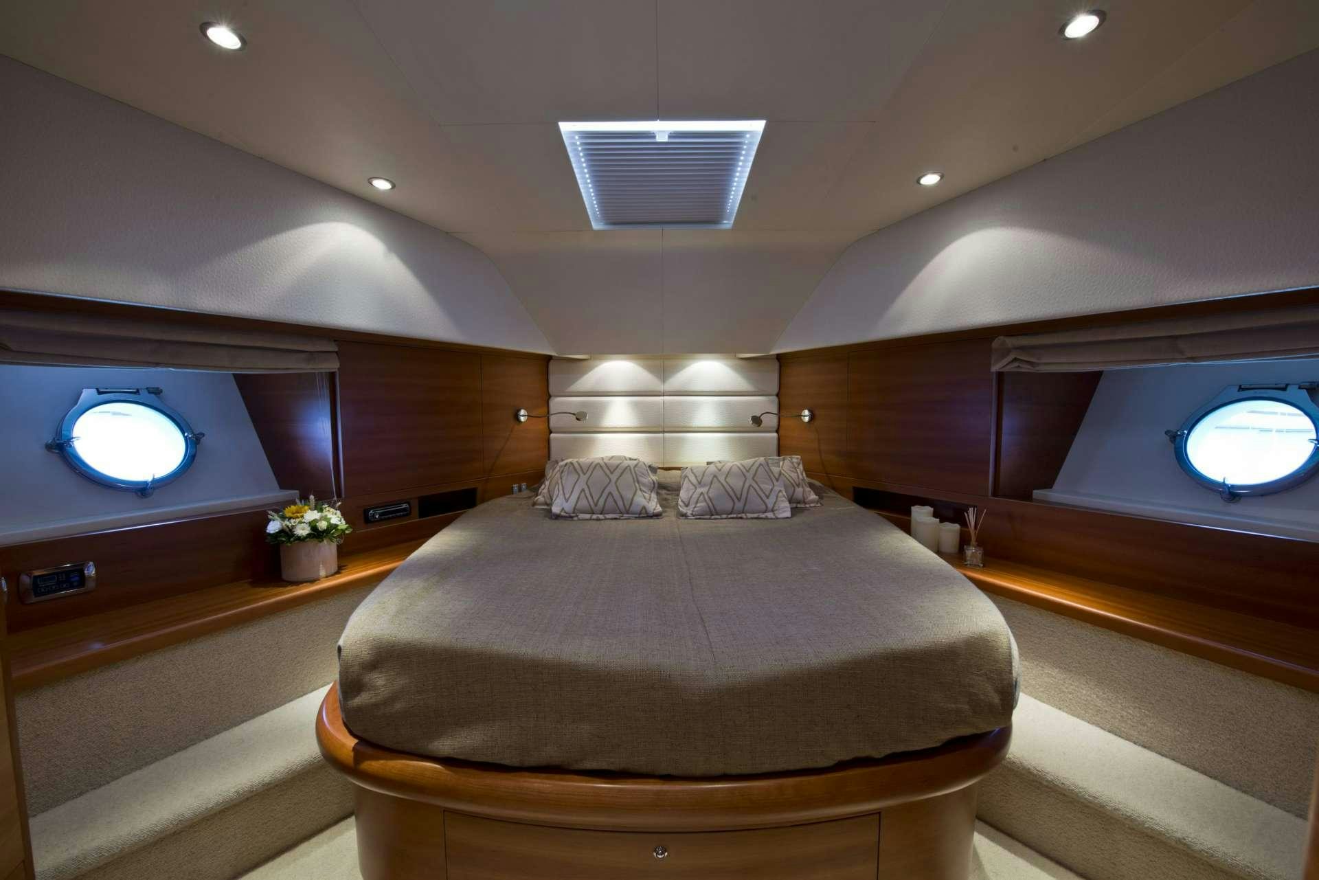 a bed in a room aboard JULY Yacht for Charter