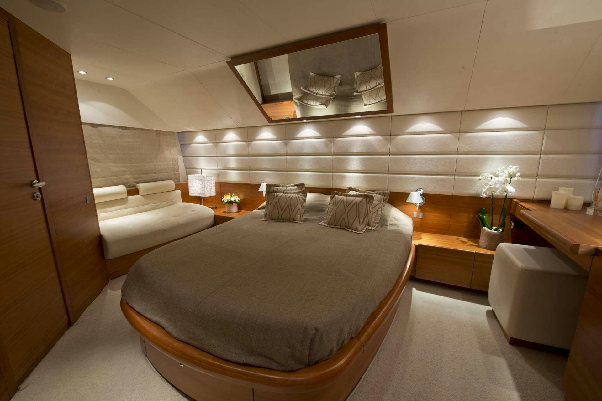 a room with a bed and a sink aboard JULY Yacht for Charter