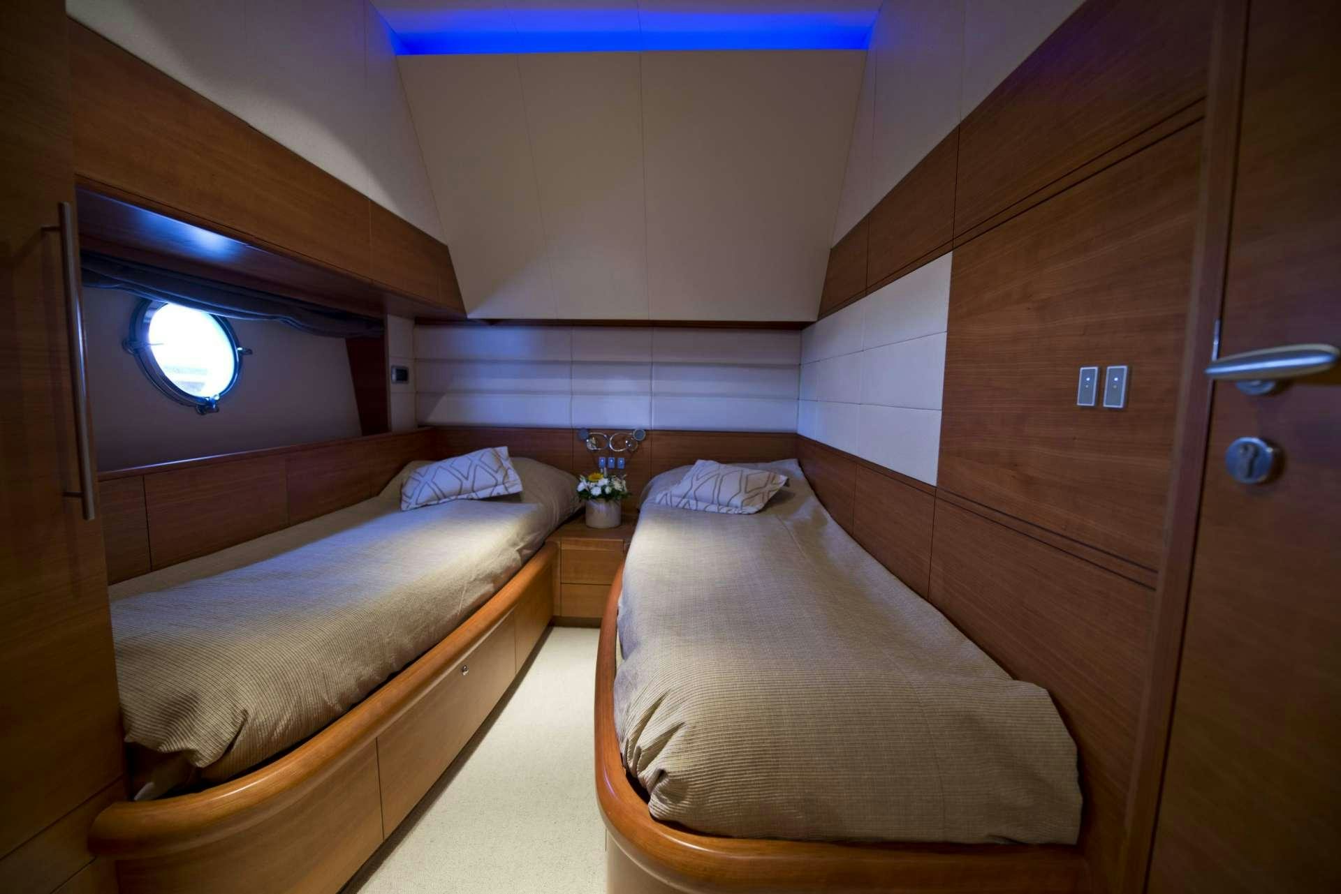 a room with two beds aboard JULY Yacht for Charter