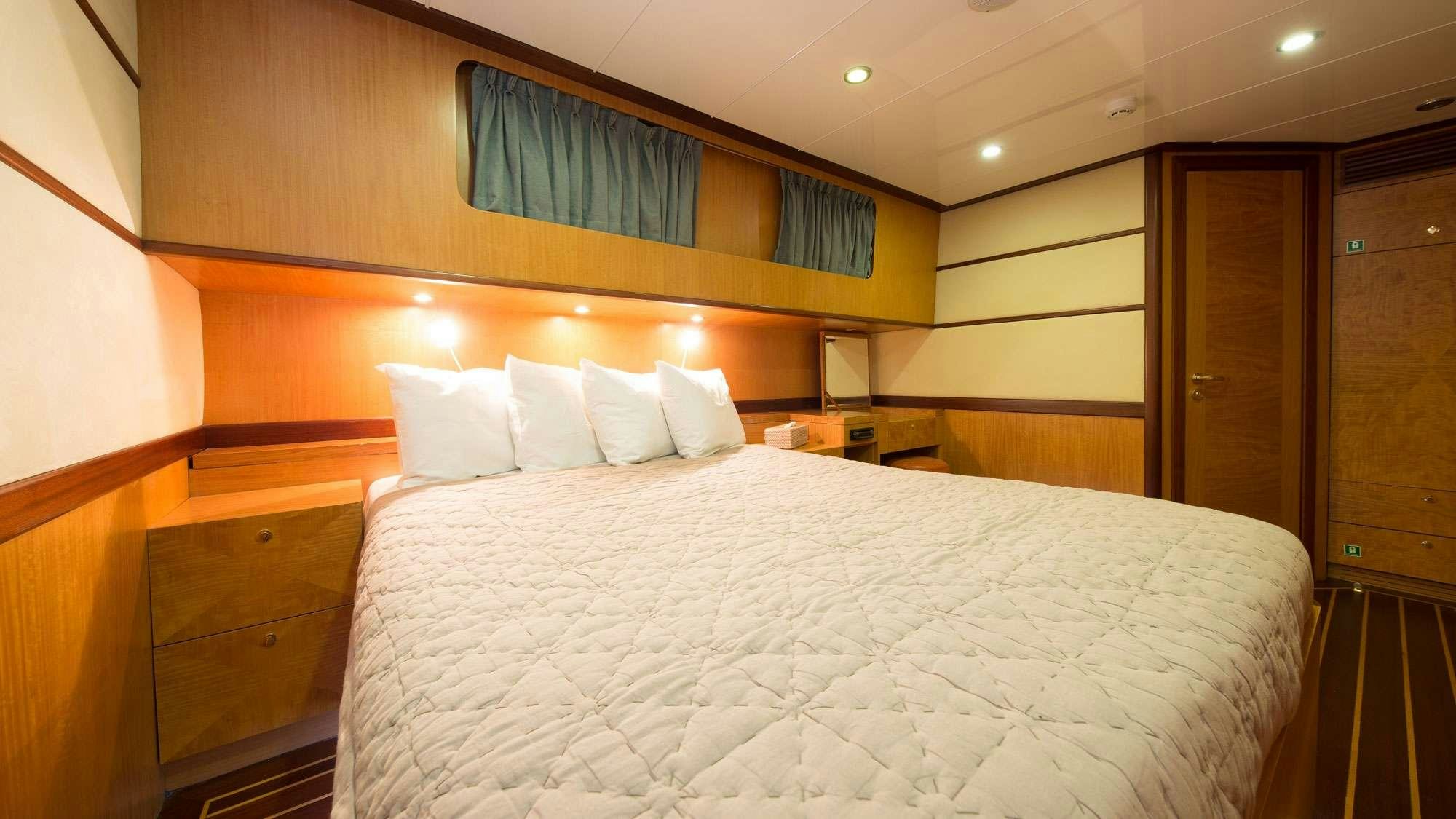 a bed in a room aboard SERENITY 86 Yacht for Charter