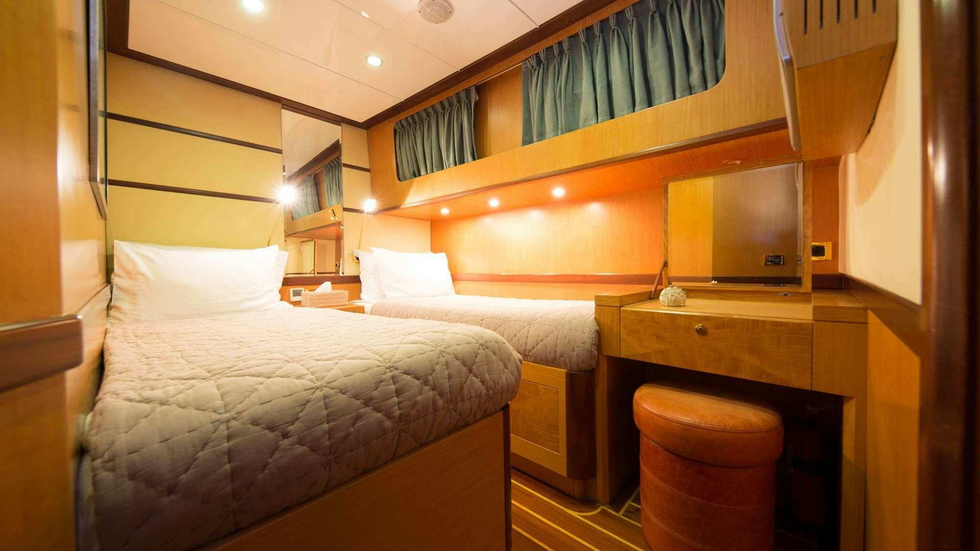 a room with two beds aboard SERENITY 86 Yacht for Charter