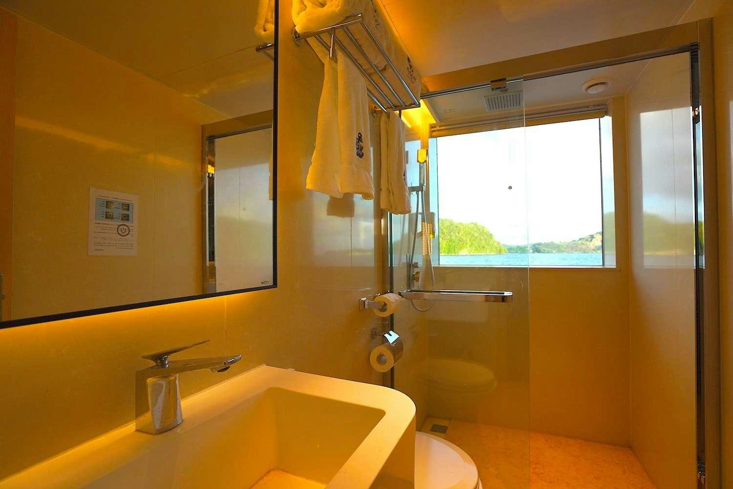 a bathroom with a sink and toilet aboard BLACK PEARL I Yacht for Charter