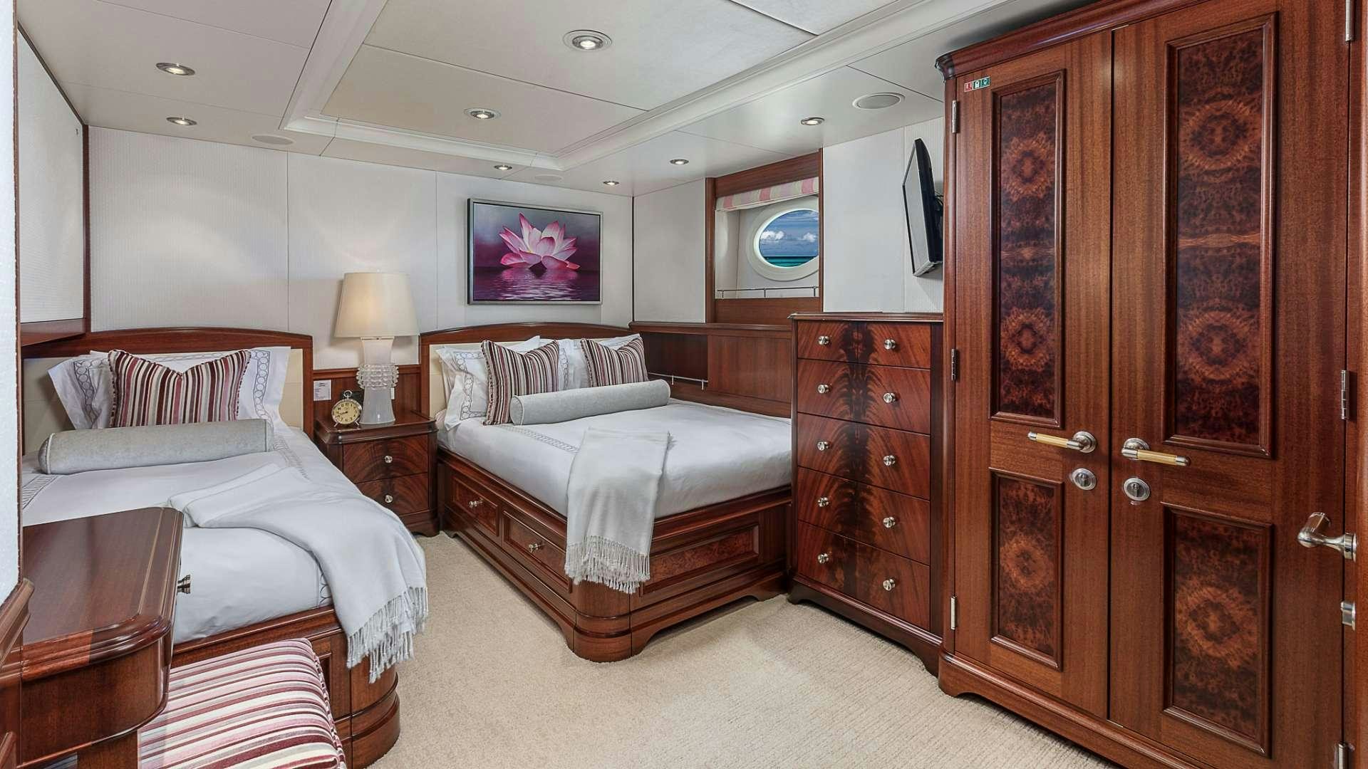 a room with two beds aboard AVALON Yacht for Charter
