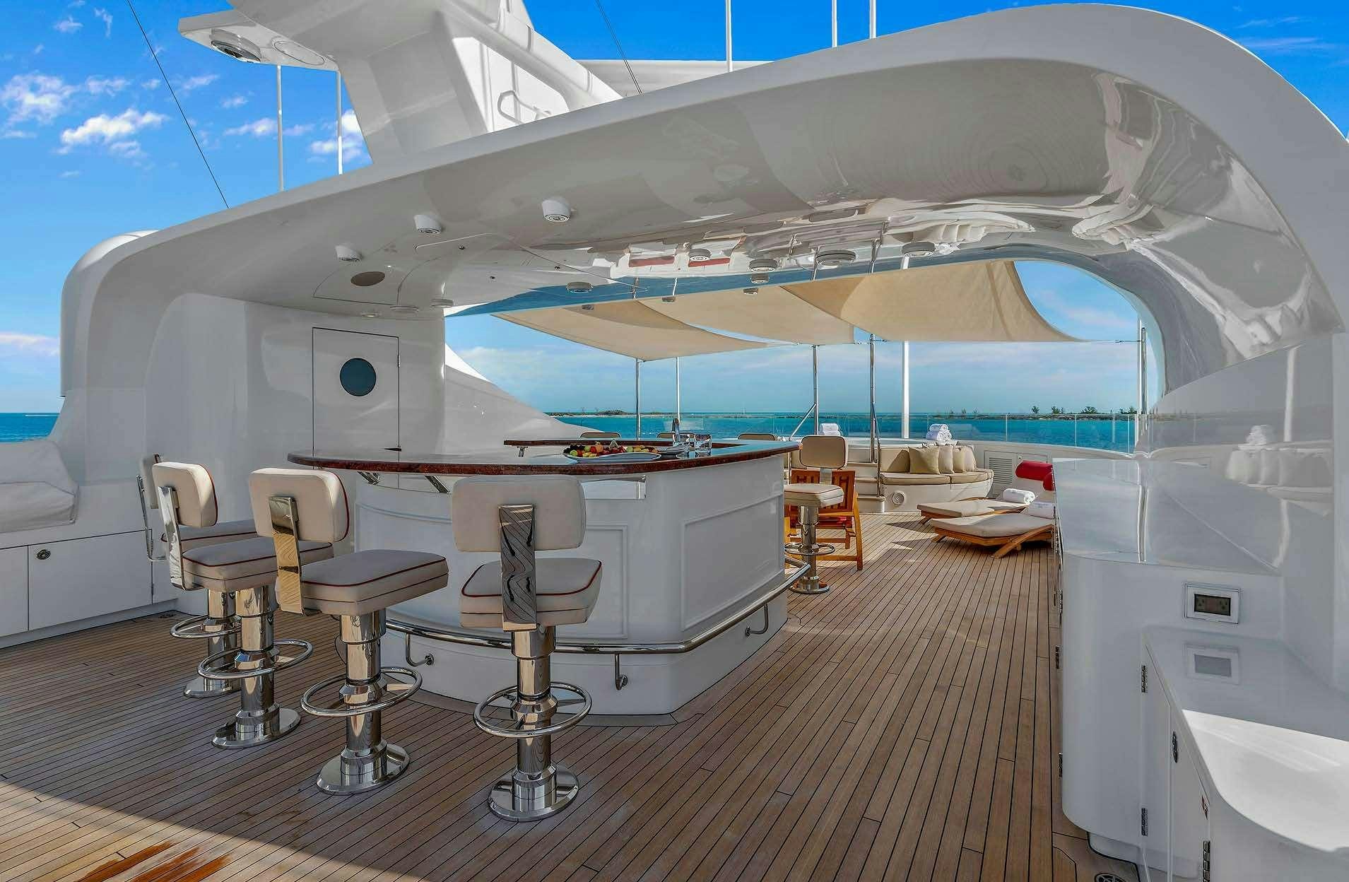 a large white tent with chairs and tables aboard AVALON Yacht for Charter