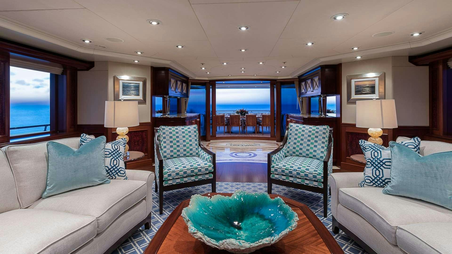 a living room with a large window aboard AVALON Yacht for Charter