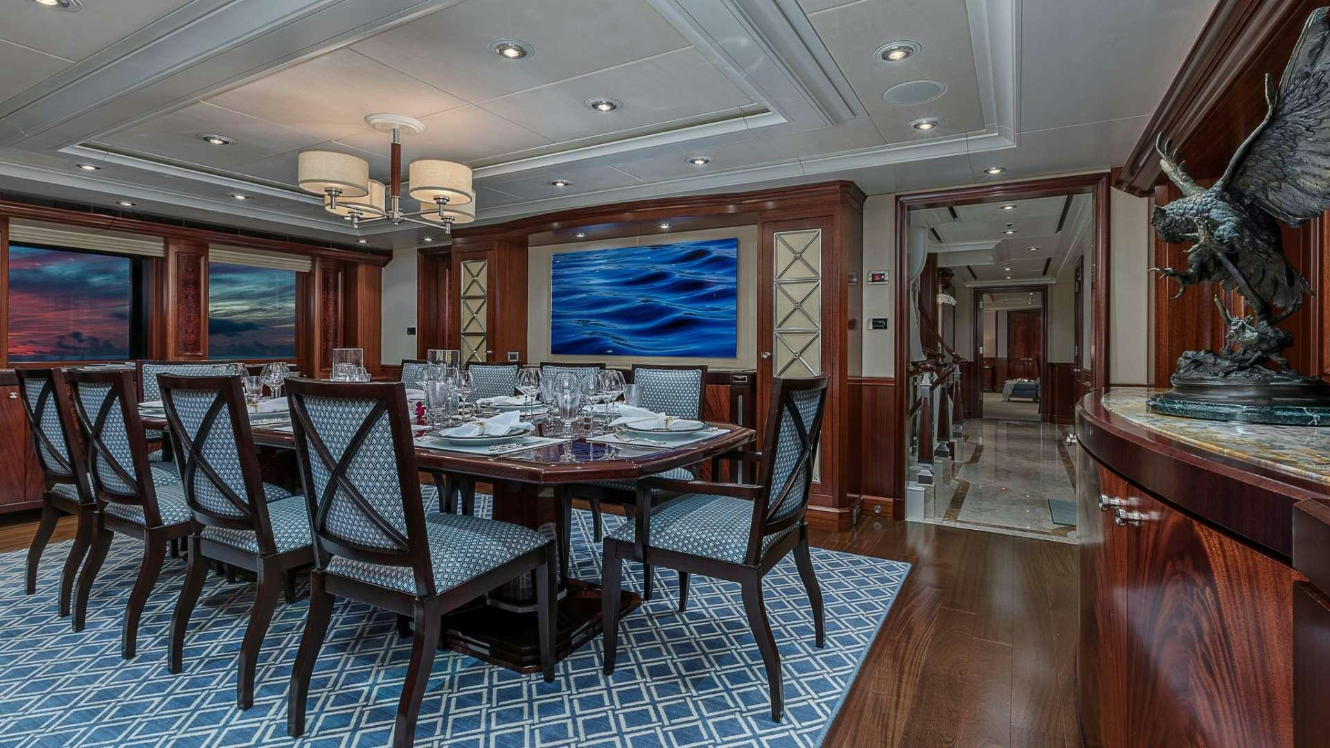 a dining room with a table and chairs aboard AVALON Yacht for Charter