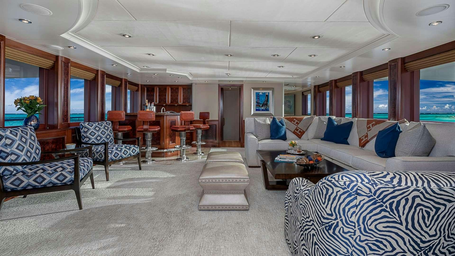 a living room with a couch and a table aboard AVALON Yacht for Charter