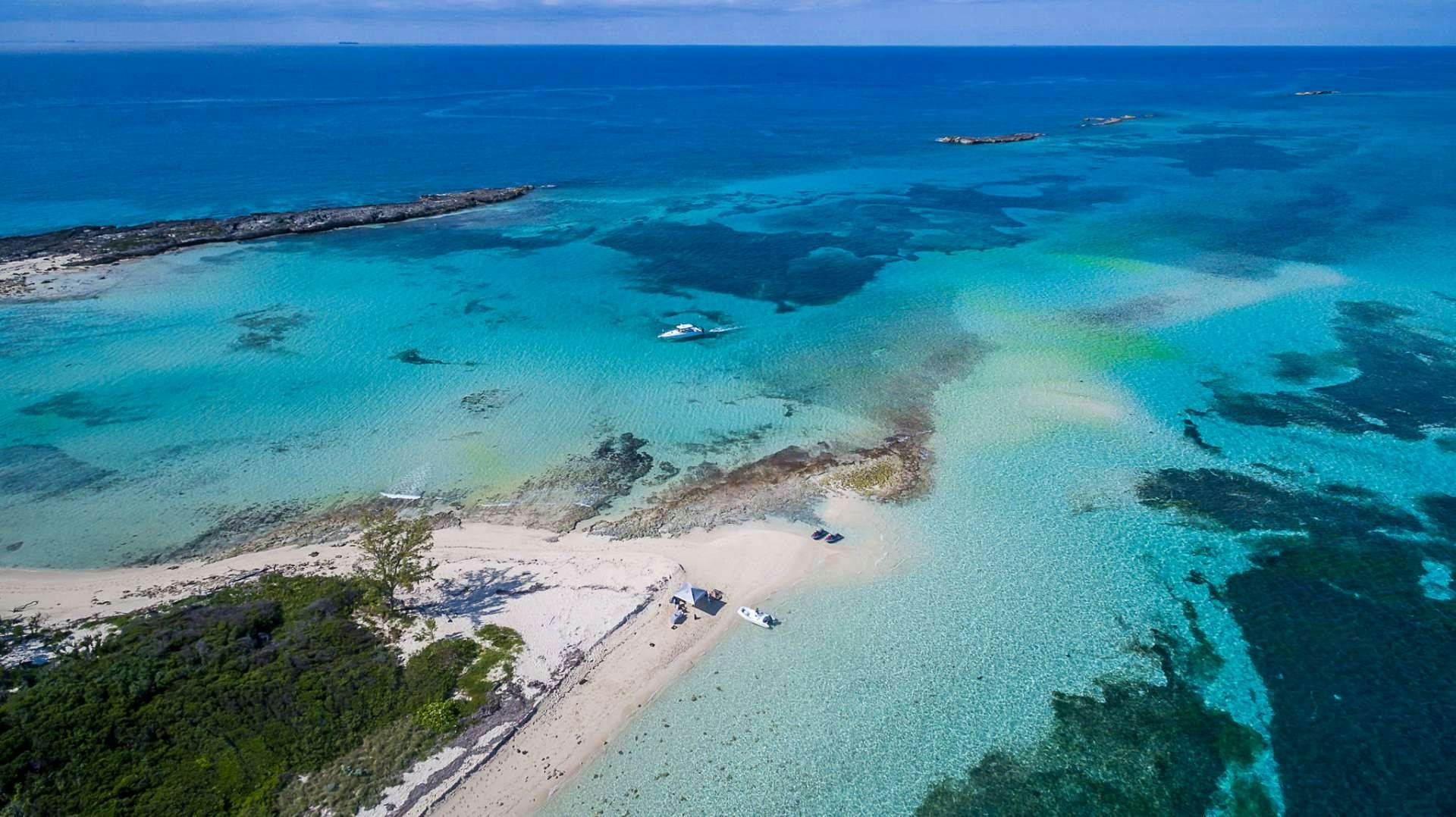 a beach with a body of water aboard AVALON Yacht for Charter