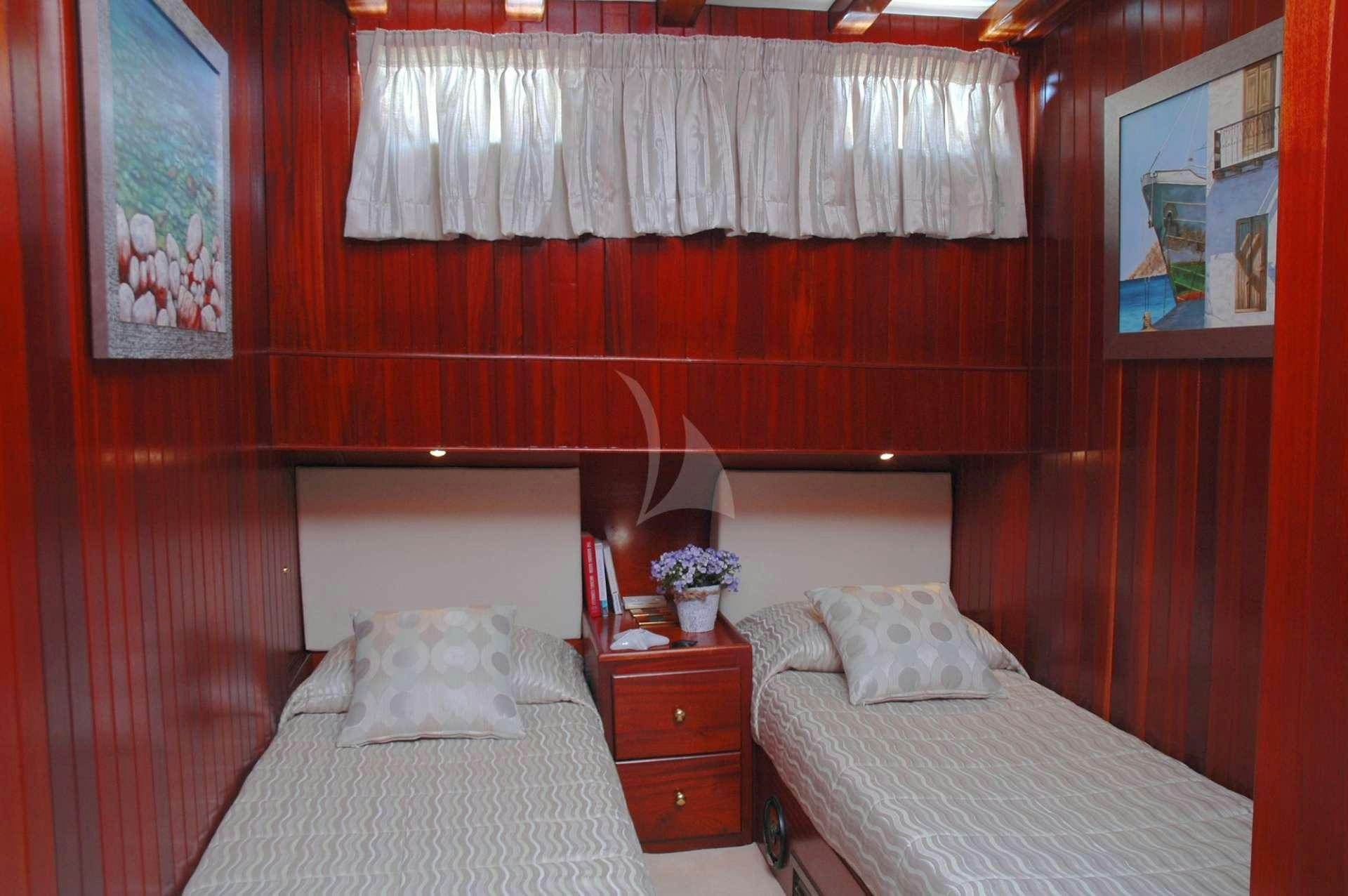 a room with two beds aboard MATINA Yacht for Charter