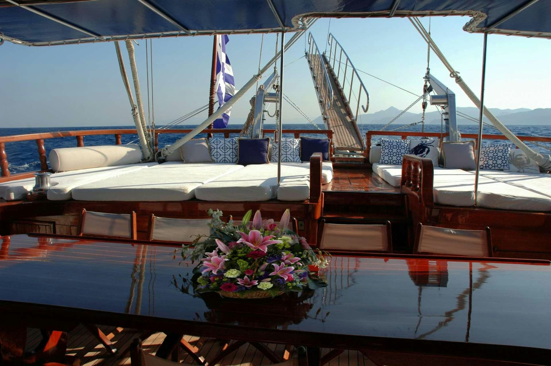 a boat with flowers in it aboard MATINA Yacht for Charter