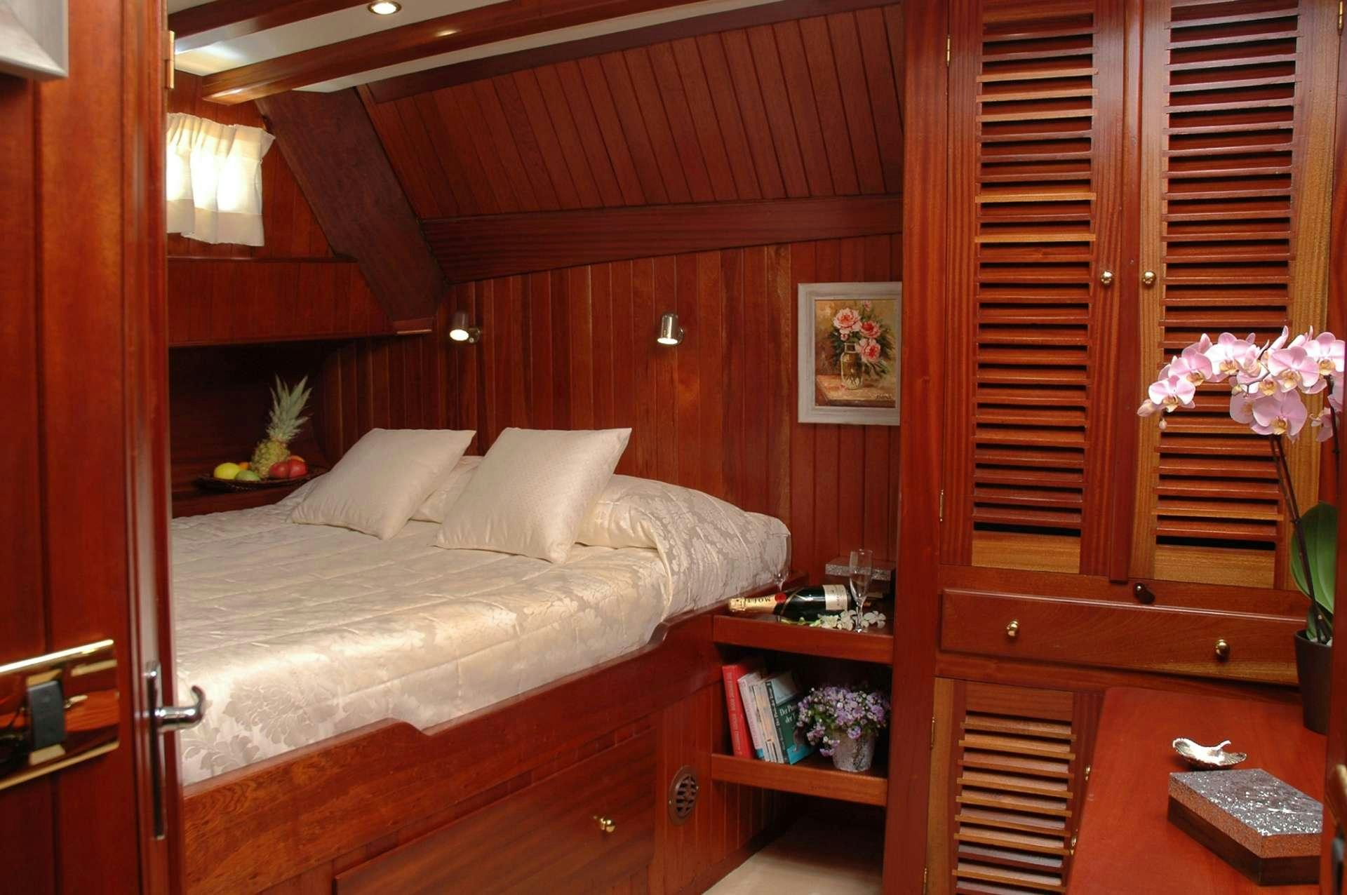 a bed in a room aboard MATINA Yacht for Charter