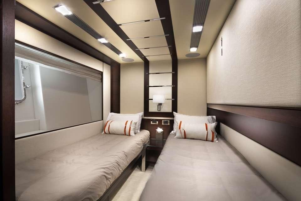 a room with two beds aboard INSIEME Yacht for Charter