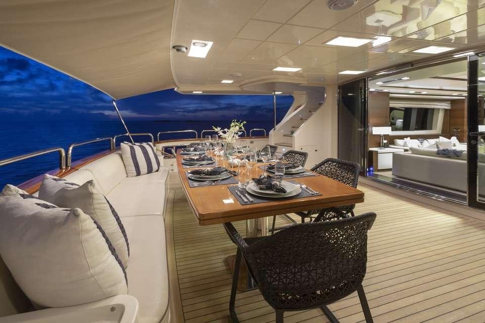 a room with a table and chairs aboard INSIEME Yacht for Charter