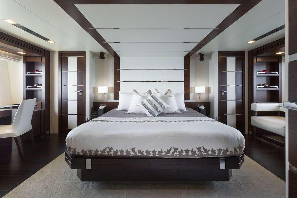 a large bed in a room aboard INSIEME Yacht for Charter