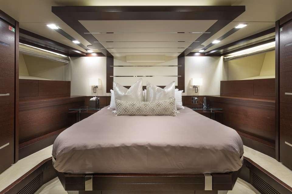 a bed in a room aboard INSIEME Yacht for Charter