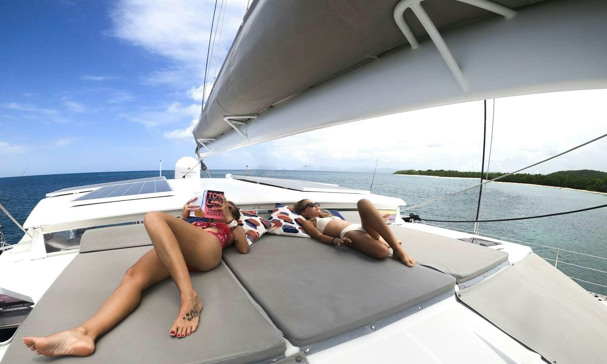 a person lying on a yacht aboard FELICIA Yacht for Charter