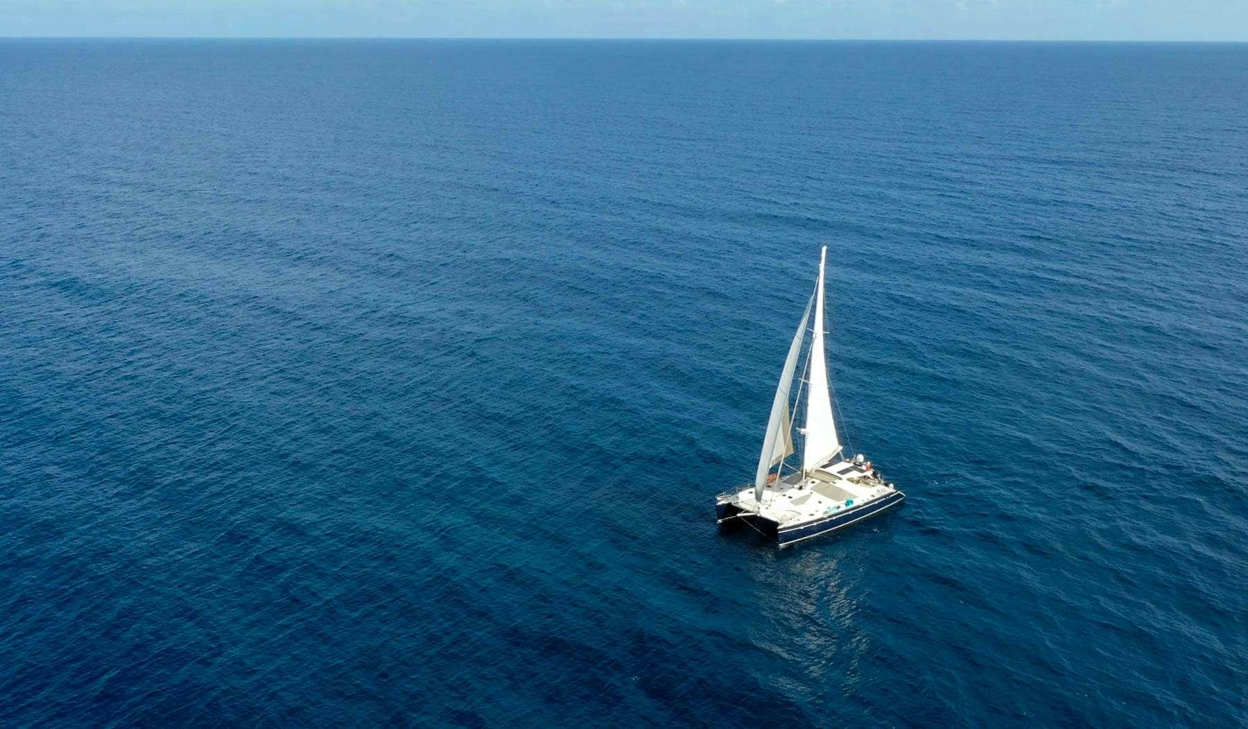 a sailboat in the ocean aboard FELICIA Yacht for Charter
