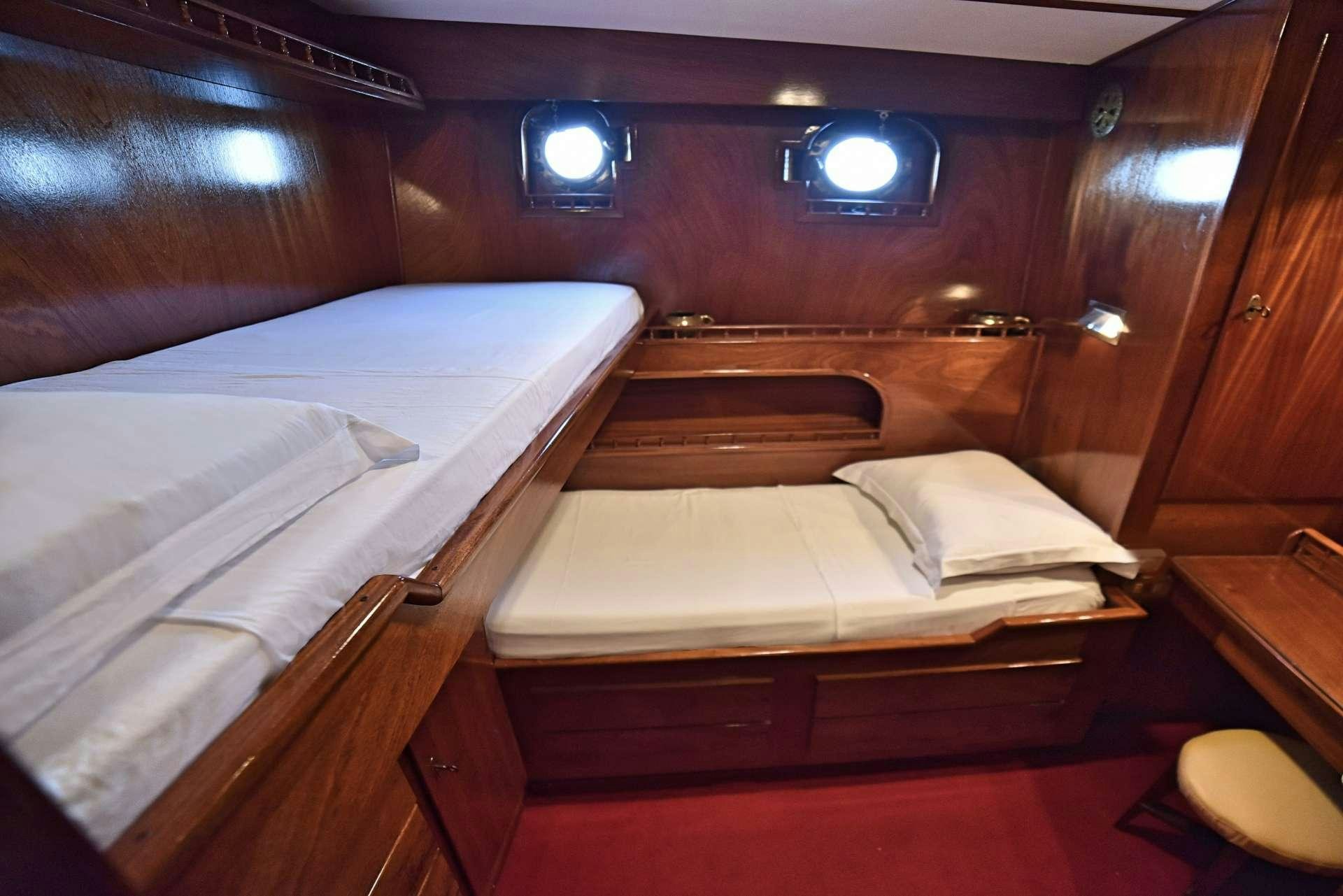 a room with bunk beds aboard ENTRANCER Yacht for Charter