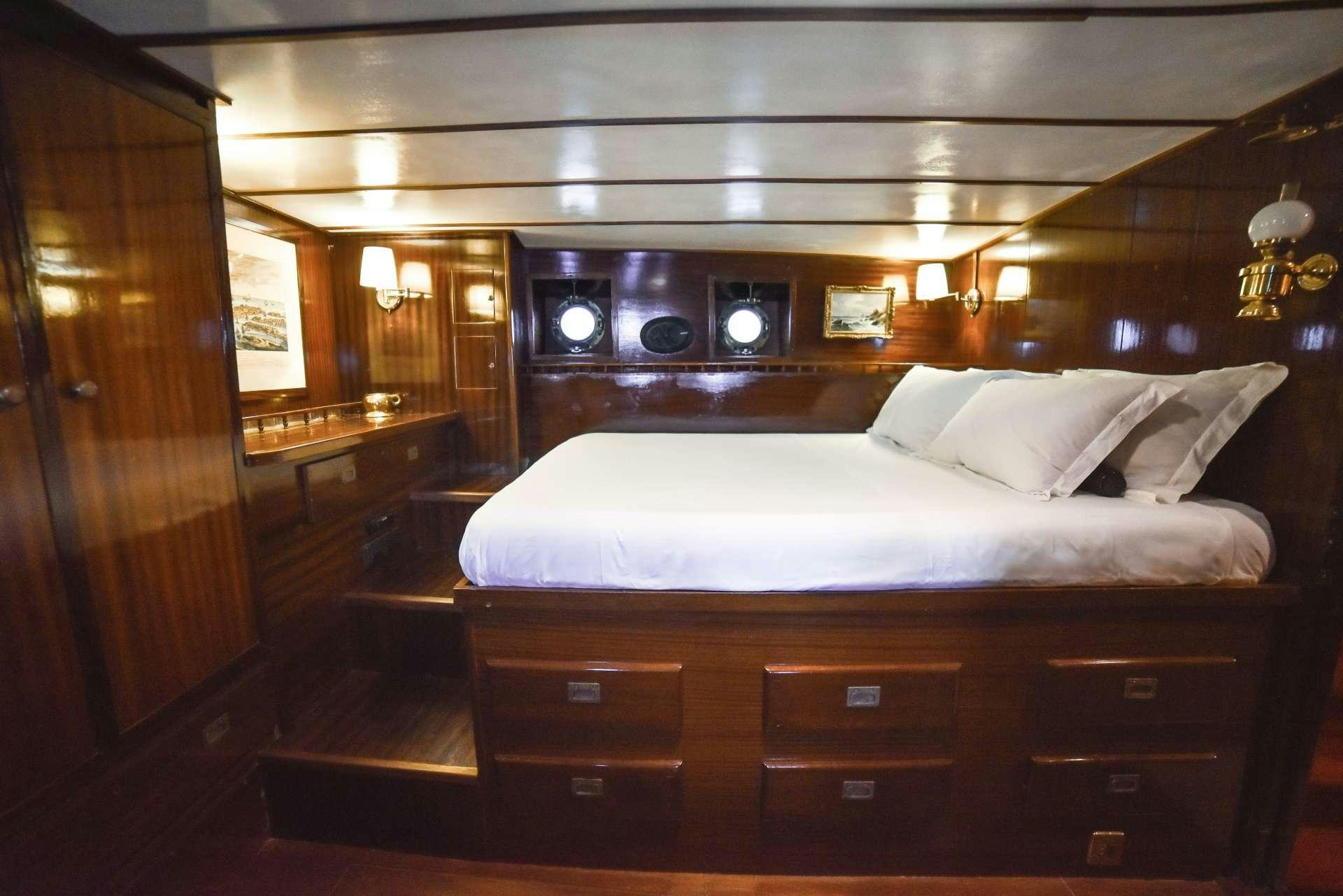 a bed in a room aboard ENTRANCER Yacht for Charter