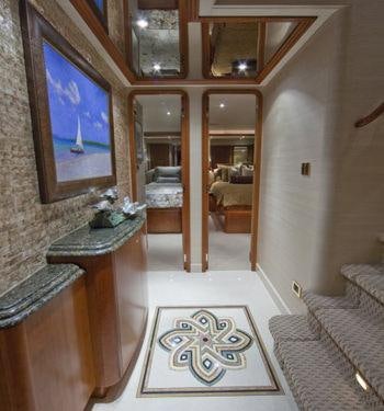a room with a mirror and a rug aboard ALICIA Yacht for Charter