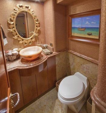 a bathroom with a mirror and sink aboard ALICIA Yacht for Charter