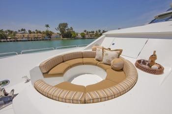 a lounge chair on a beach aboard ALICIA Yacht for Charter
