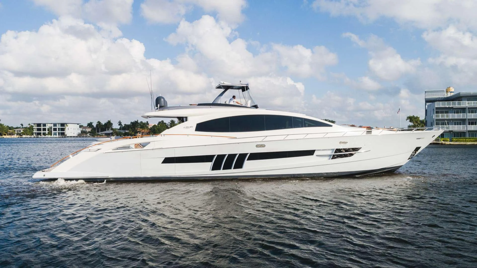 a white yacht on the water aboard HELIOS Yacht for Charter