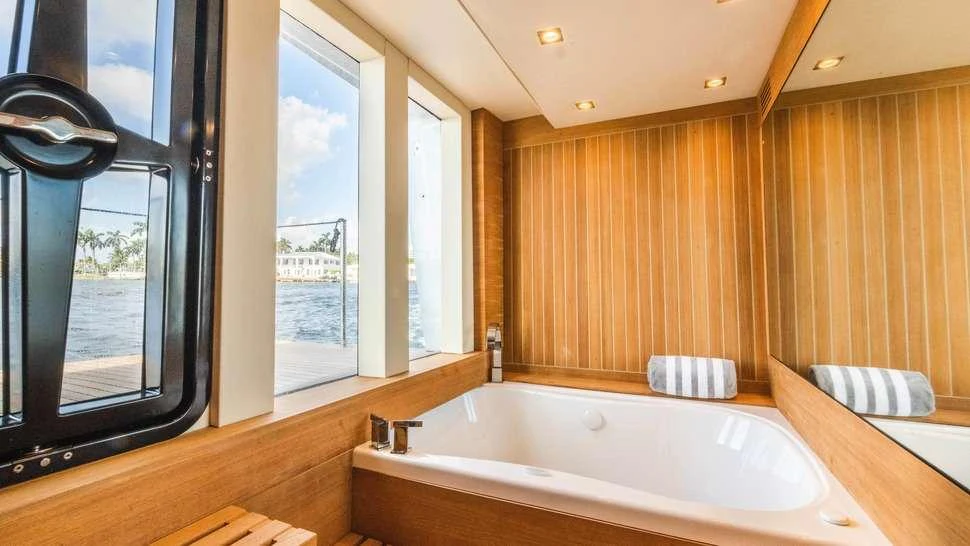 a bathroom with a large bathtub aboard HELIOS Yacht for Charter