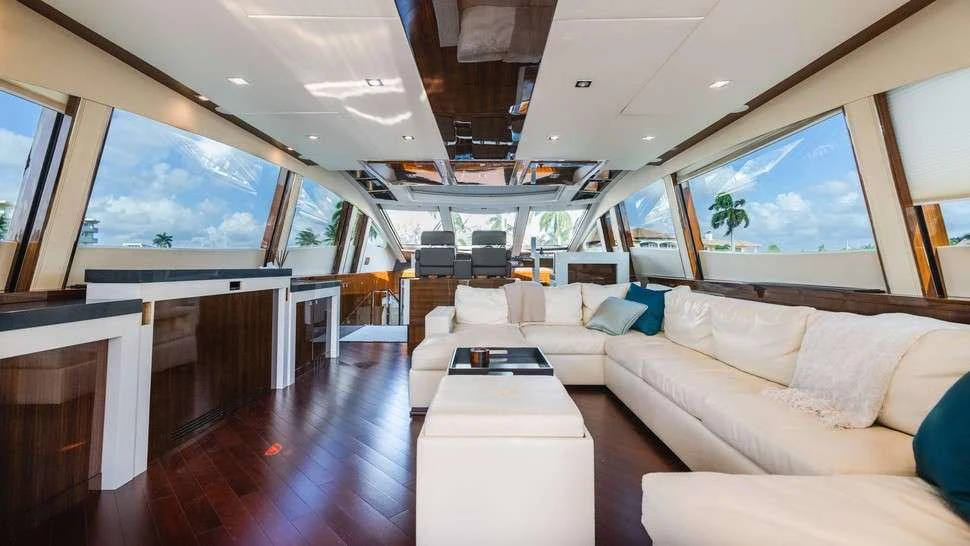 a room with a couch and a table aboard HELIOS Yacht for Charter