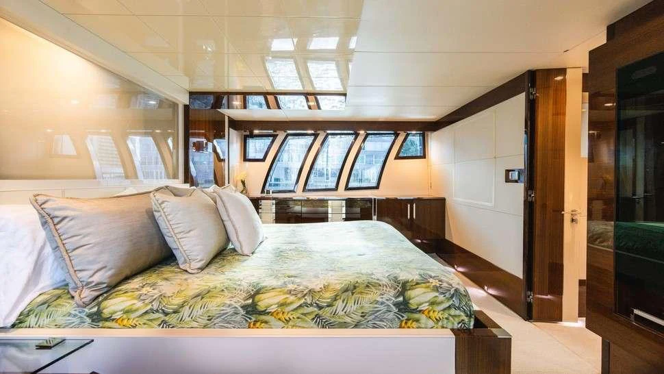 a large bed in a room aboard HELIOS Yacht for Charter