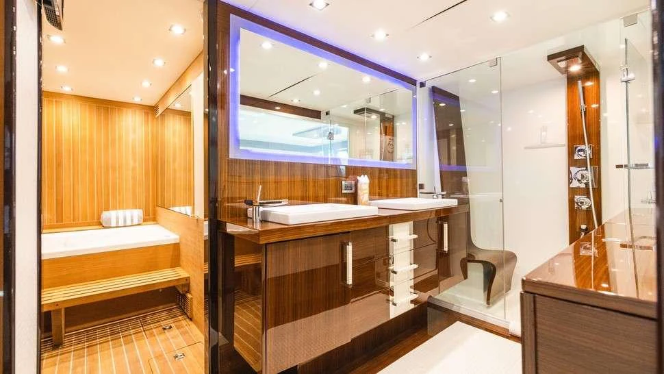 a bathroom with a large mirror aboard HELIOS Yacht for Charter