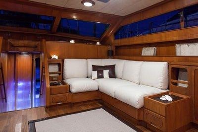 a room with a couch and a table aboard MY LOTTY Yacht for Charter