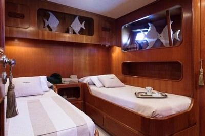 a couple of beds in a room aboard MY LOTTY Yacht for Charter