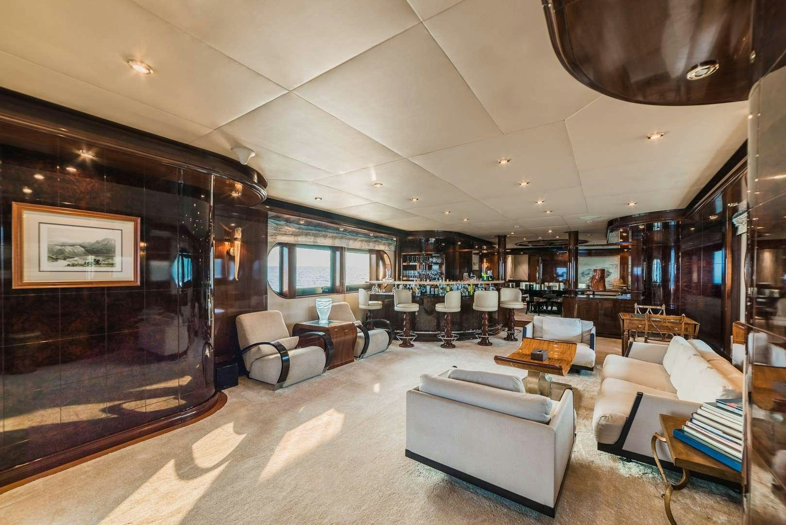 a large living room with a large screen aboard ASHENA Yacht for Charter
