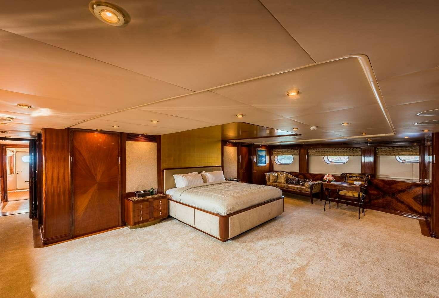 a large living room with a large mirror aboard ASHENA Yacht for Charter
