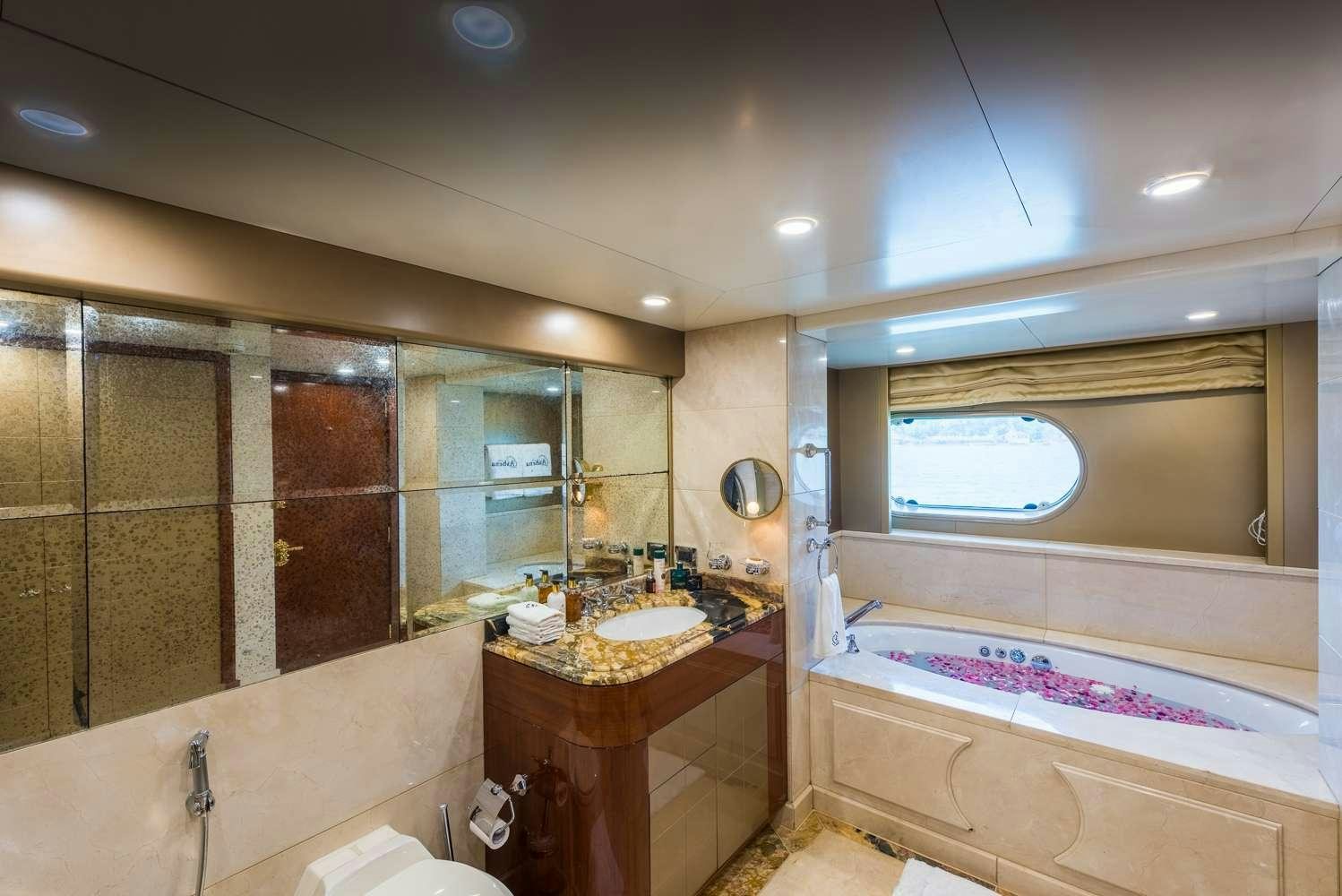 a bathroom with a sink and a bathtub aboard ASHENA Yacht for Charter