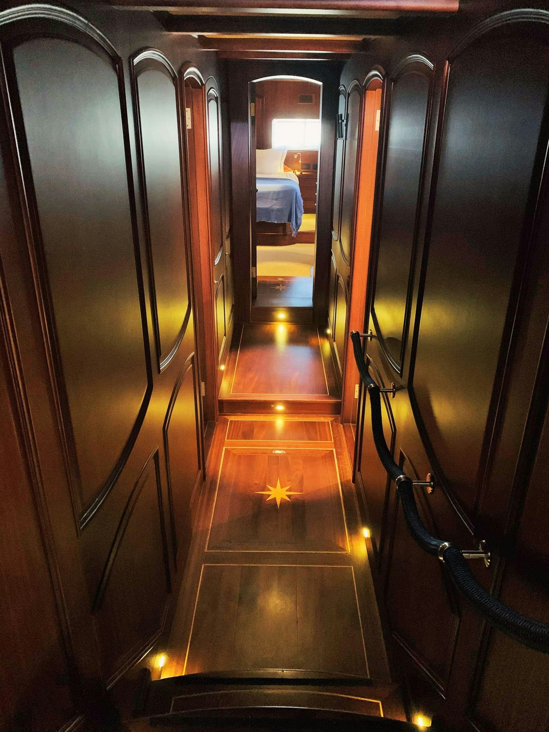 a hallway with mirrors aboard VOYAGE Yacht for Charter