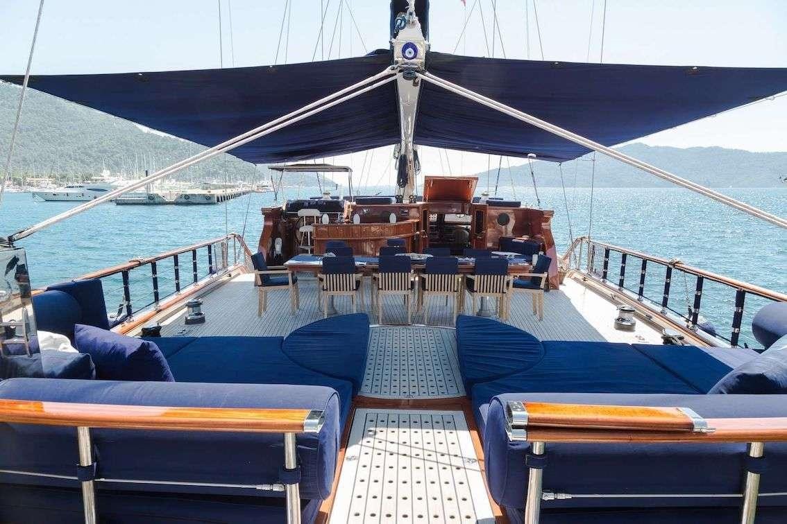 a boat with a group of people on it aboard VOYAGE Yacht for Charter
