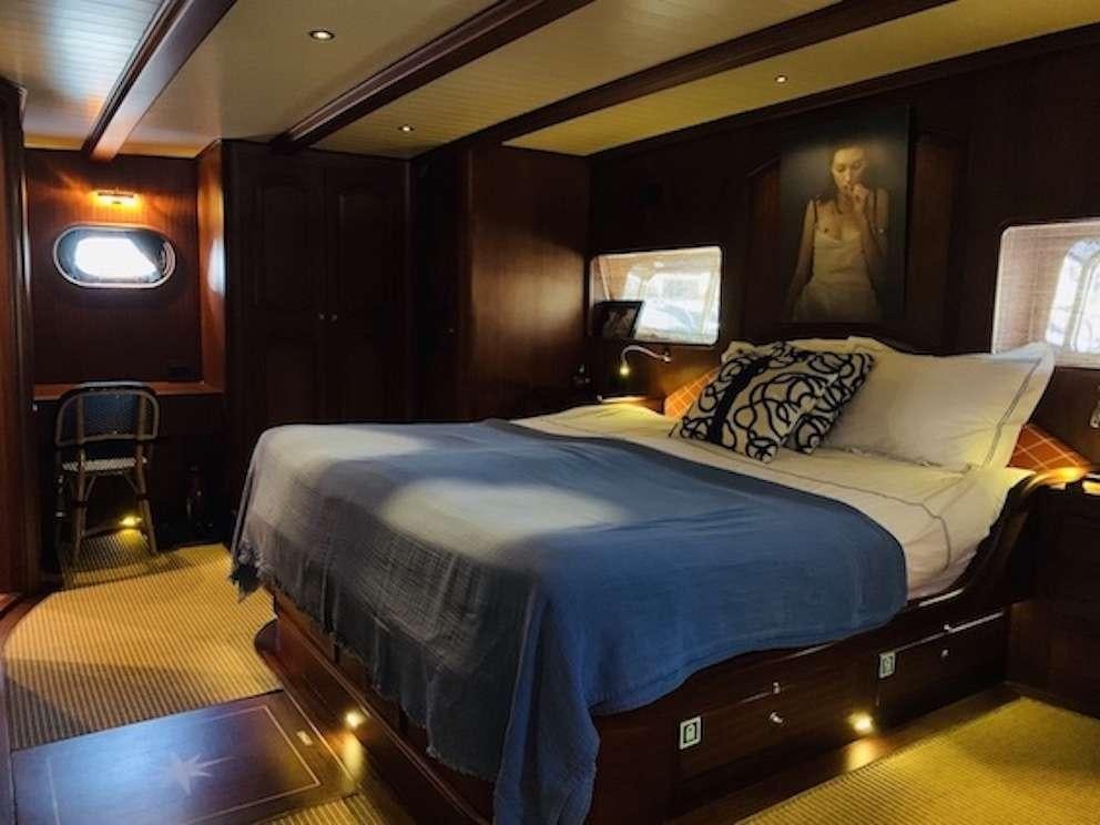 a bed in a room aboard VOYAGE Yacht for Charter