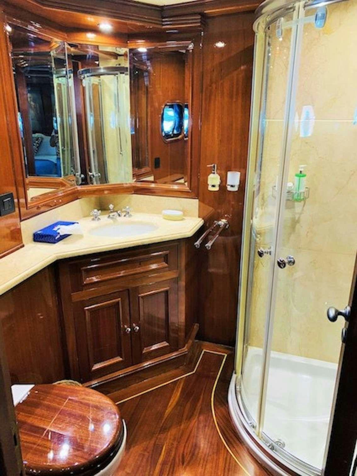 a bathroom with a shower and sink aboard VOYAGE Yacht for Charter