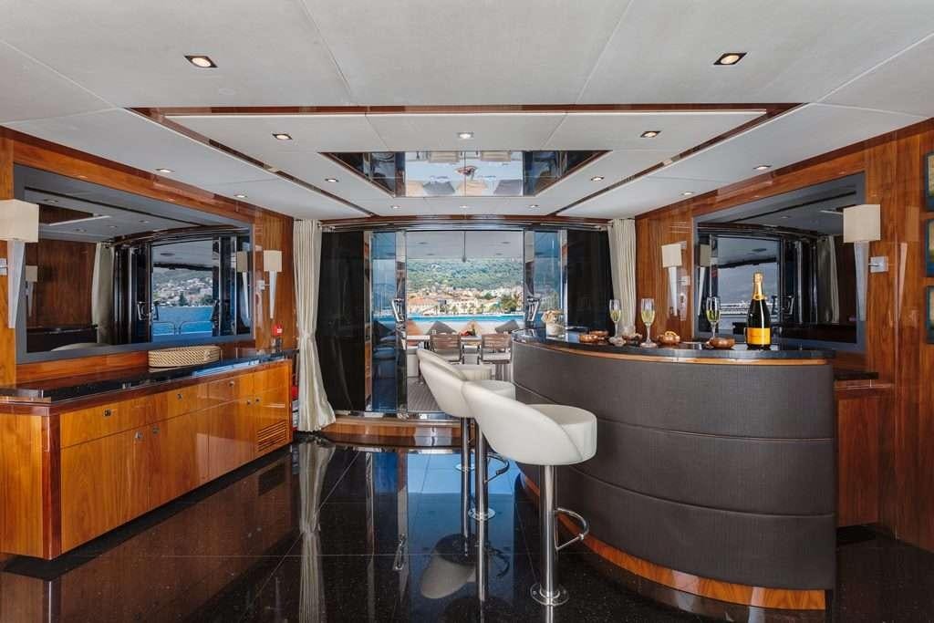 a kitchen with a bar and a bar aboard BARACUDA Yacht for Charter