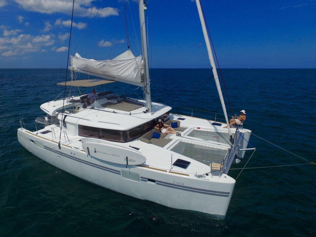 a white boat on the water aboard SAMORU Yacht for Charter