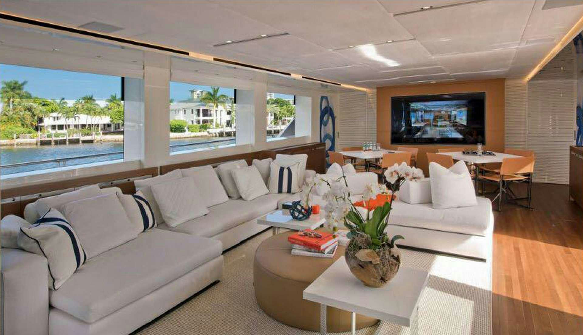a living room with a large window aboard MORNING STAR Yacht for Charter