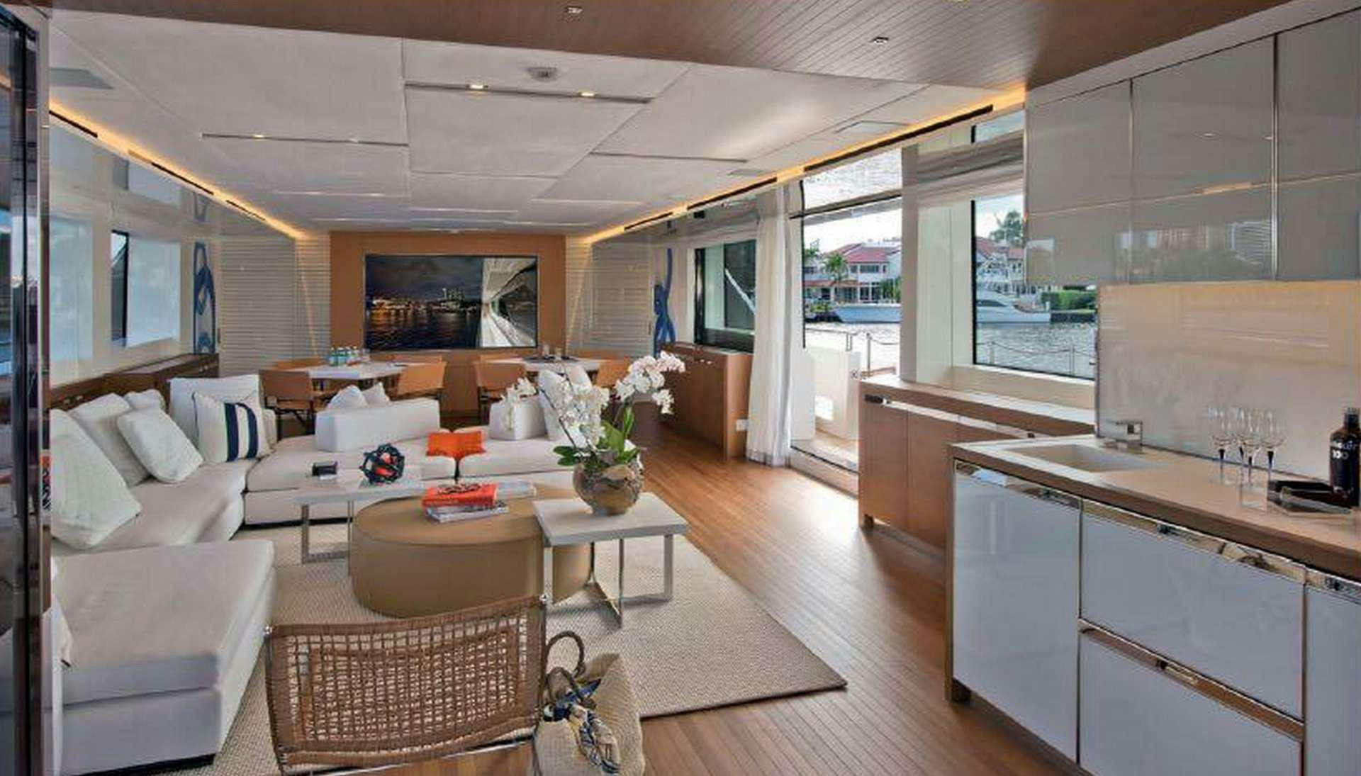 a large living room with a kitchen aboard MORNING STAR Yacht for Charter