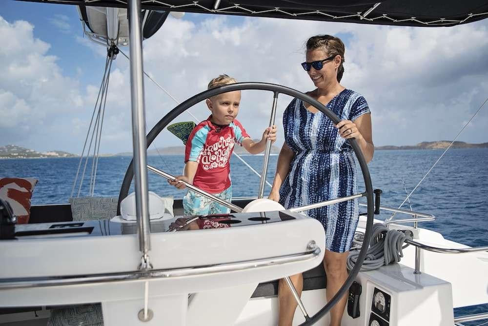 a man and a child on a boat aboard SOUTHERN COMFORT Yacht for Charter