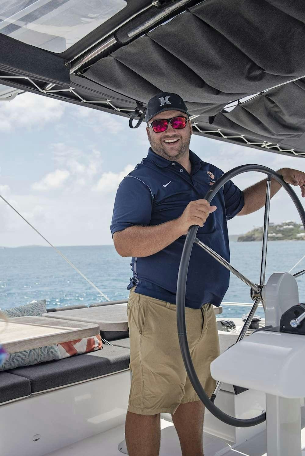 a man on a boat aboard SOUTHERN COMFORT Yacht for Charter