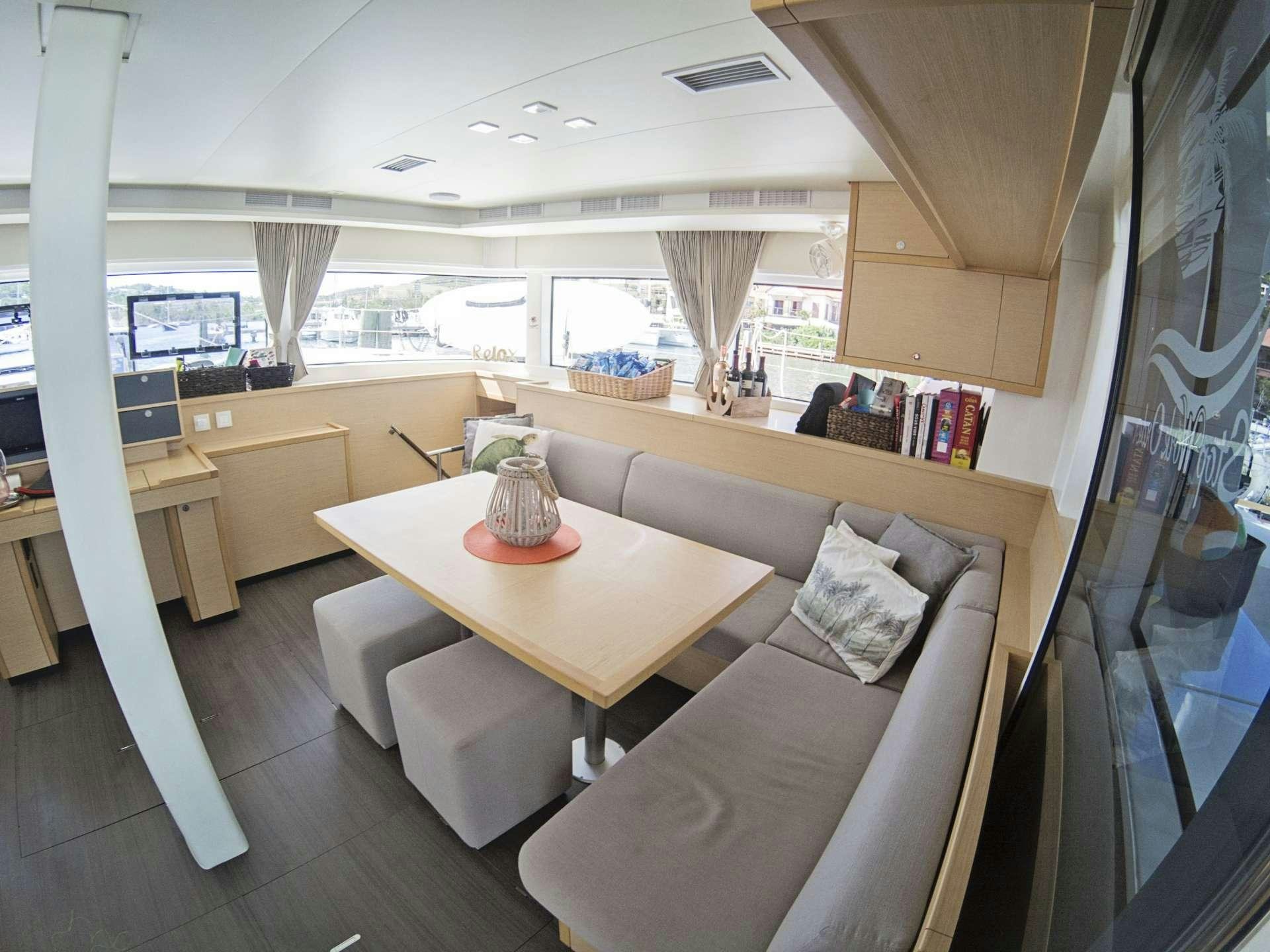 a living room with a large window aboard SOUTHERN COMFORT Yacht for Charter