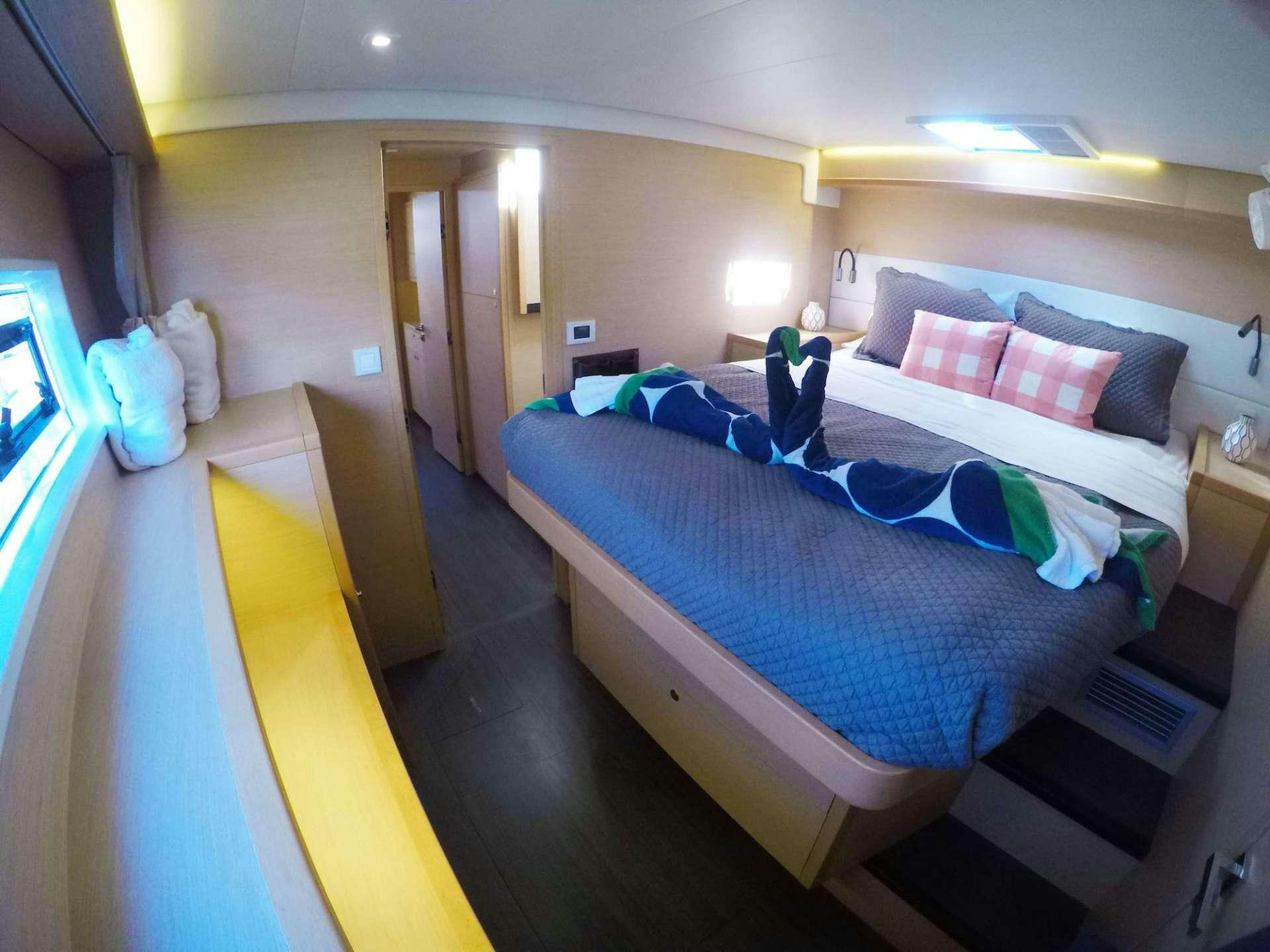 a bedroom with a bed and a desk aboard SOUTHERN COMFORT Yacht for Charter