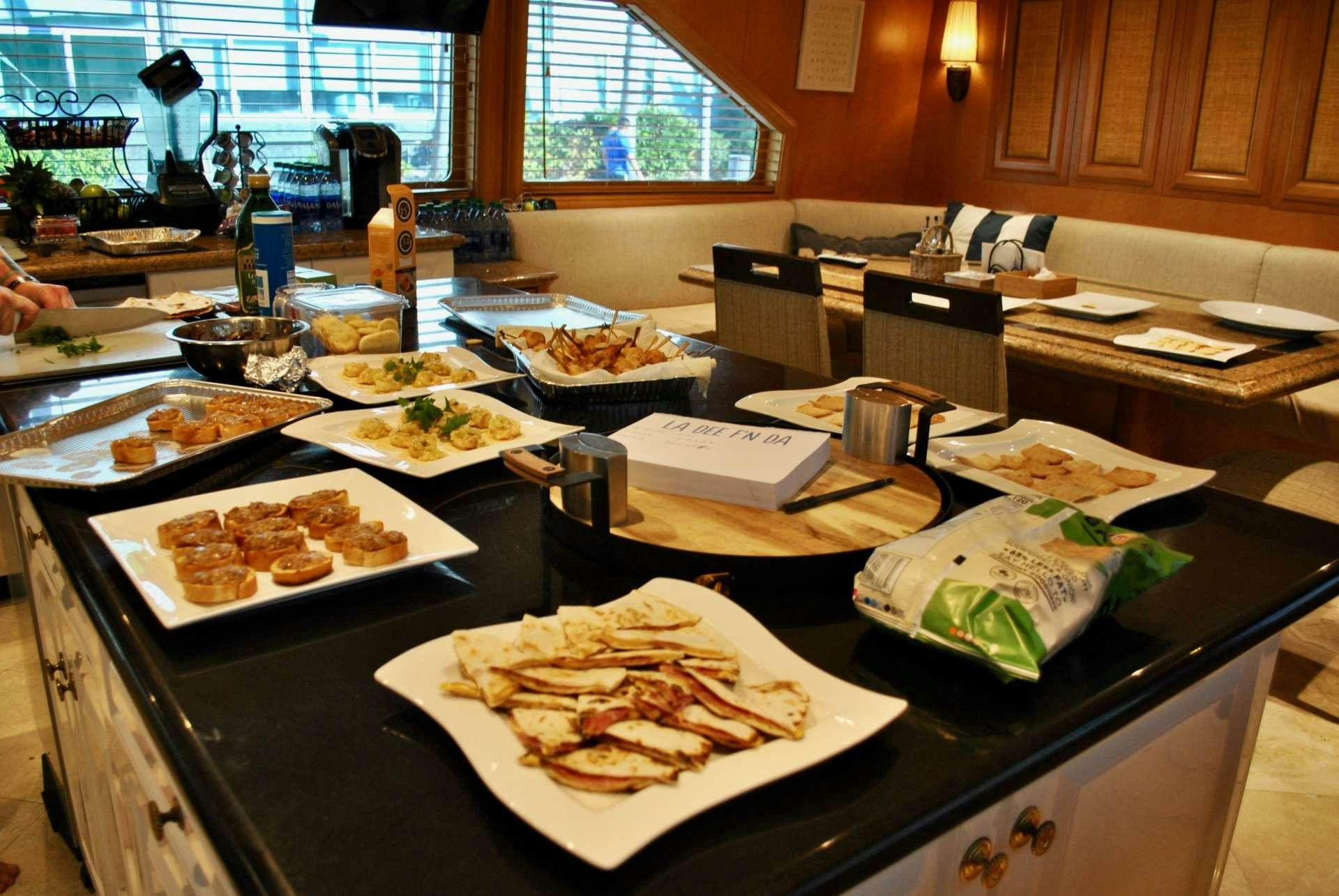 a table full of food aboard LADY LEX Yacht for Charter