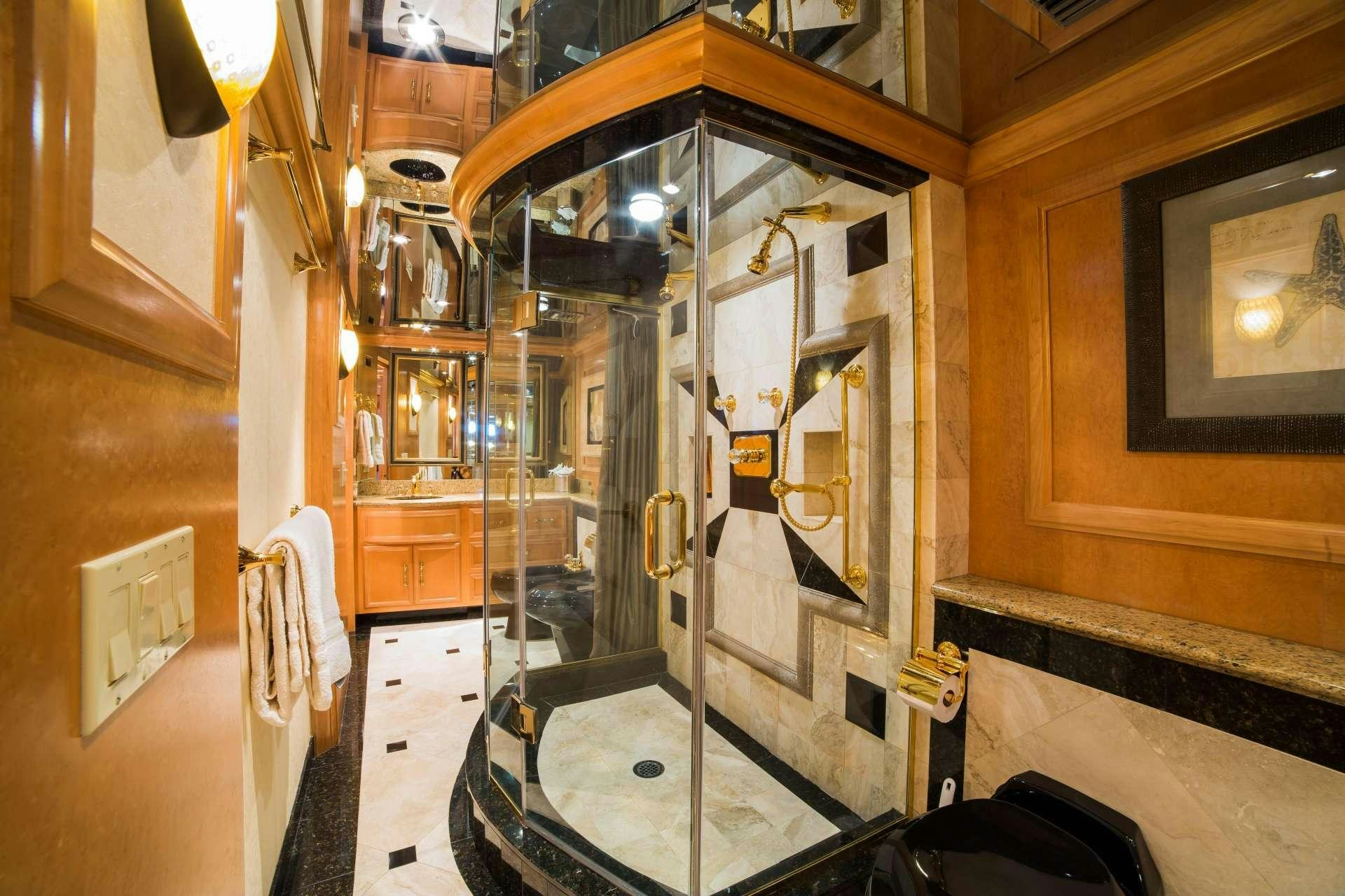 a bathroom with a shower unit aboard LADY LEX Yacht for Charter